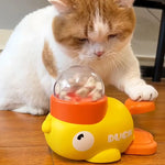 Interactive treat dispenser for cats and dogs in the shape of a yellow duck, durable plastic training toy
